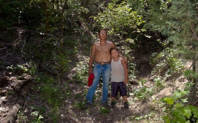 Rob Lawrence and his 7-year-old son, Zuya Cicala, on the morning after the Sun Dance at Red Shirt Table, Pine Ridge Reservation.