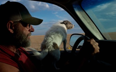 Hay Springs, Nebraska.August 29, 2012..Jim Mracek and his dog drive through Sheridan County in search of the priarie fires that have started from lighting because of the extremely dry condition of the land during the drought. Often, due to the remote location and limited firefighting resources, ranchers and their neighbors have to try and put the fires out themselves.