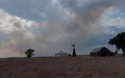 Hay Springs, Nebraska August 28, 2012  Smoke from prairie fires drifts past an abandoned farm house. The dry conditions brought on by the drought have threatened many farms with wildfires started by lighting.