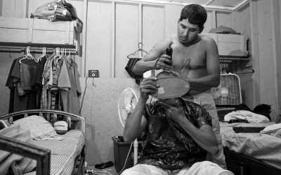 Clinton, North Carolina September 2011  Rodrigo Martinez gives his roommate Jesus Garcia a haircut.