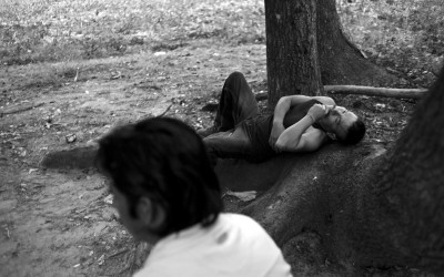Clinton, North Carolina. September 2011  Migrant workers relax after working a 12 hour work day. On average they workers make about $65 a day from picking tobacco or other crops.