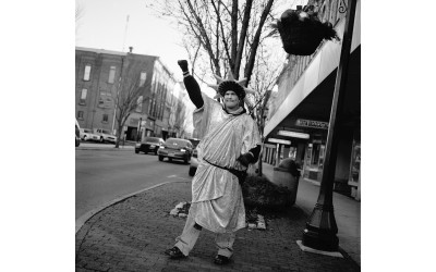 A man dressed as the Statue of Liberty hands out leaflets for an income tax preparation service, Tiffin, Ohio.