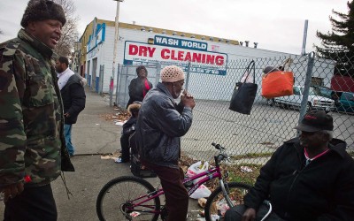 All in the game, smoking crack: Street dealer selling crack to a user on his bike. "The mayor is overseeing the selling.” (The “mayor” is Ronnie, a drug dealer and former nightclub owner.) Many areas of East Oakland have been plagued by high crime, violence and drug activity.